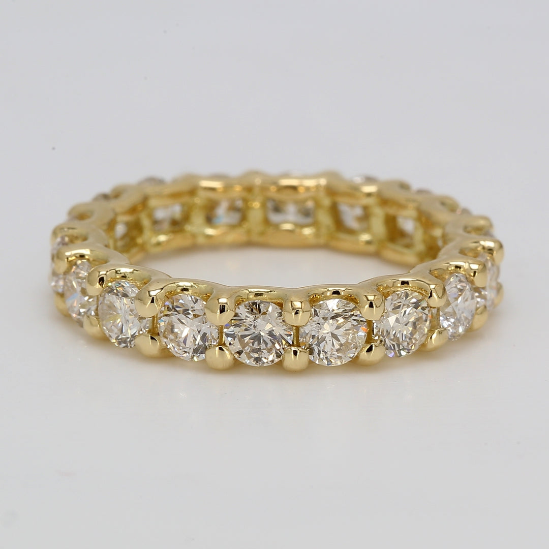 Eternity band in 18K YG with U-prong set round diamonds.  D3.33ct.t.w.  Size 7.5