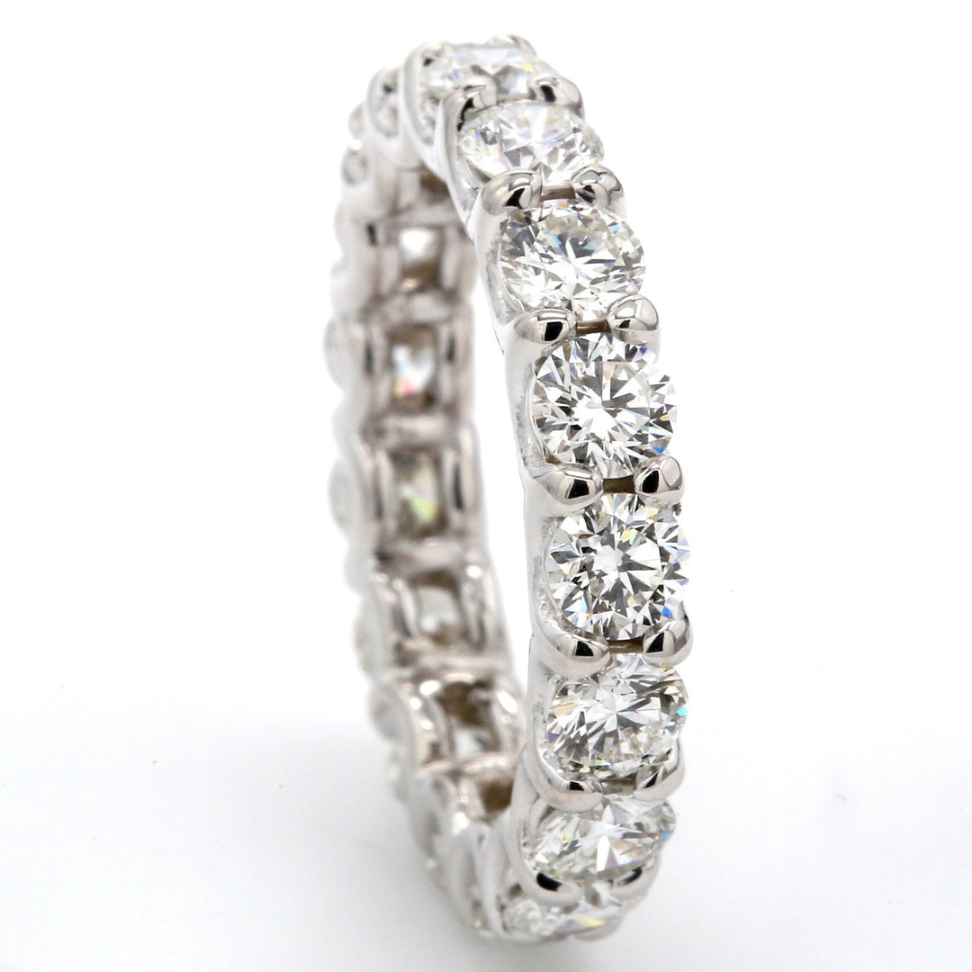 Eternity band with shared U-prong set (17) round diamonds.  D3.12ct.t.w.