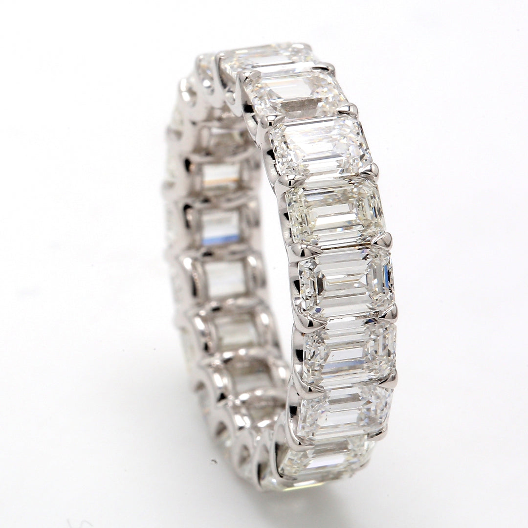 Eternity band with shared U-prong set (19) emerald cut diamonds.  D5.79ct.t.w.  Size 4.5