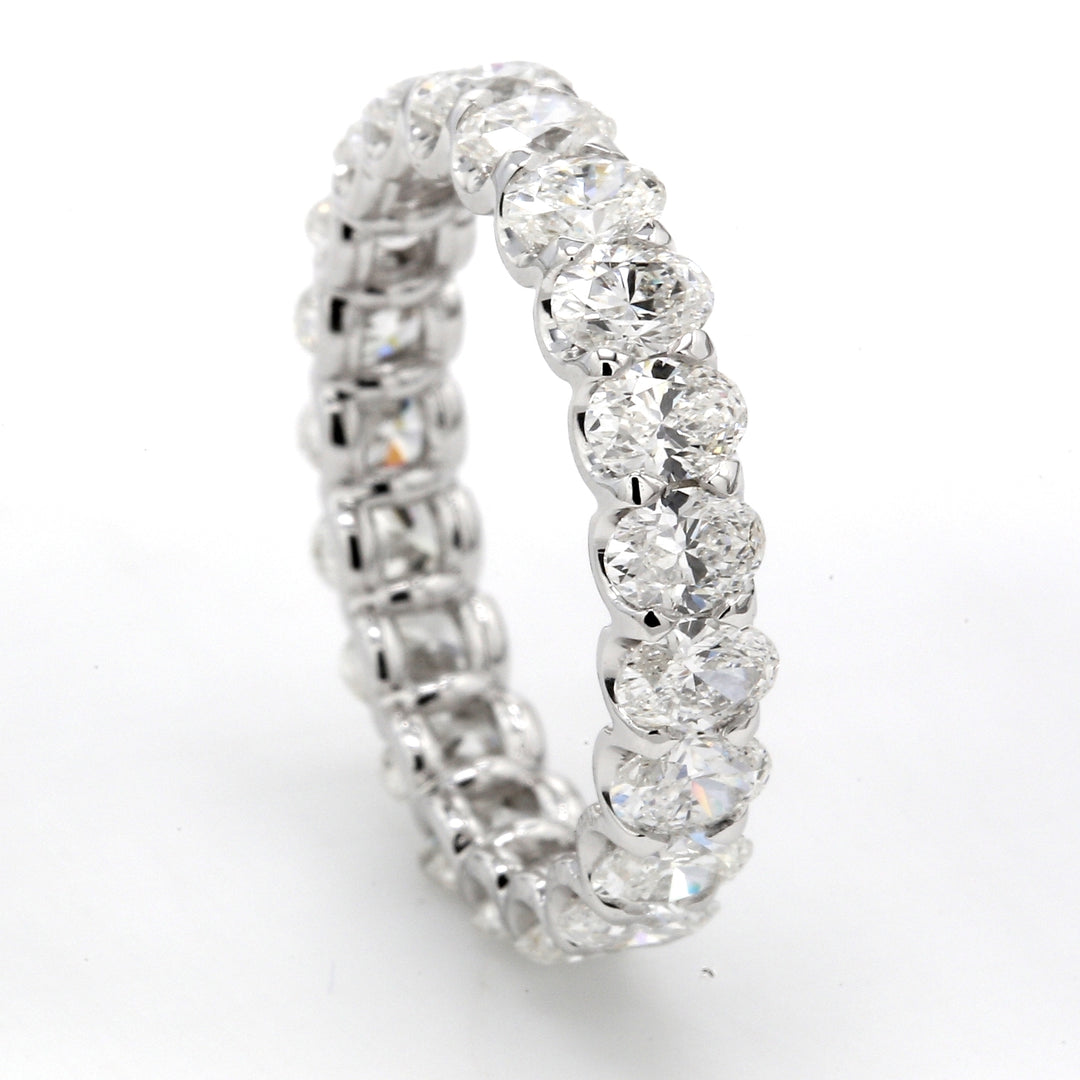 Eternity band with shared U-prong set E-F/VS+ (21) oval diamonds.  D3.02ct.t.w.  Size 6