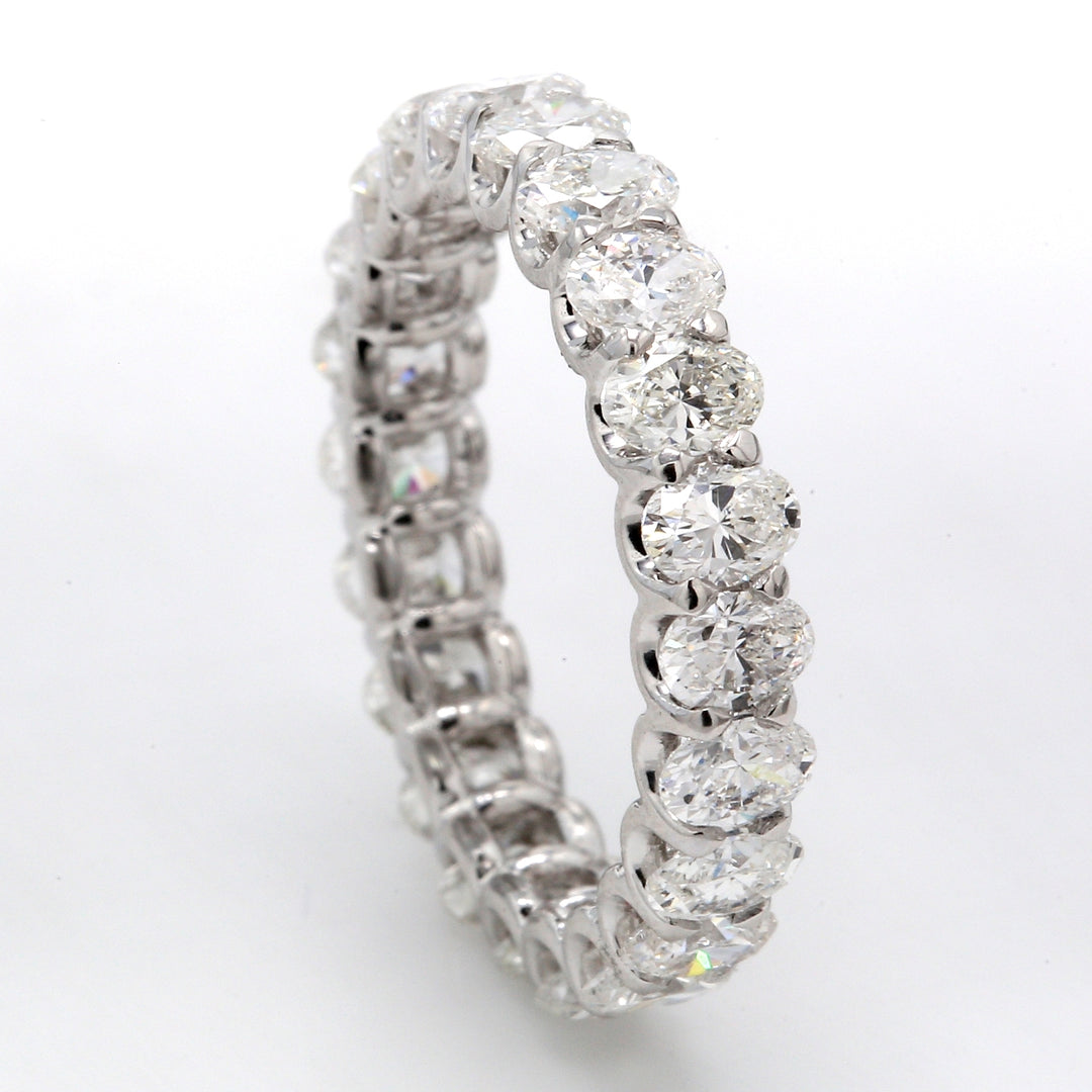 Eternity band with shared U-prong set E-F/VS (22) oval diamonds.  D2.99ct.t.w.  Size 5.5