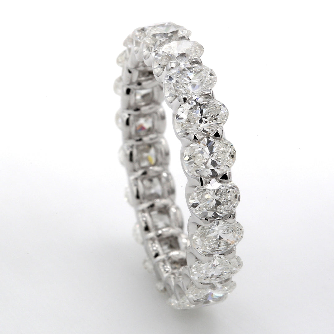 Eternity band with shared U-prong set (21) oval diamonds.  D2.92ct.t.w.  Size 5.25
