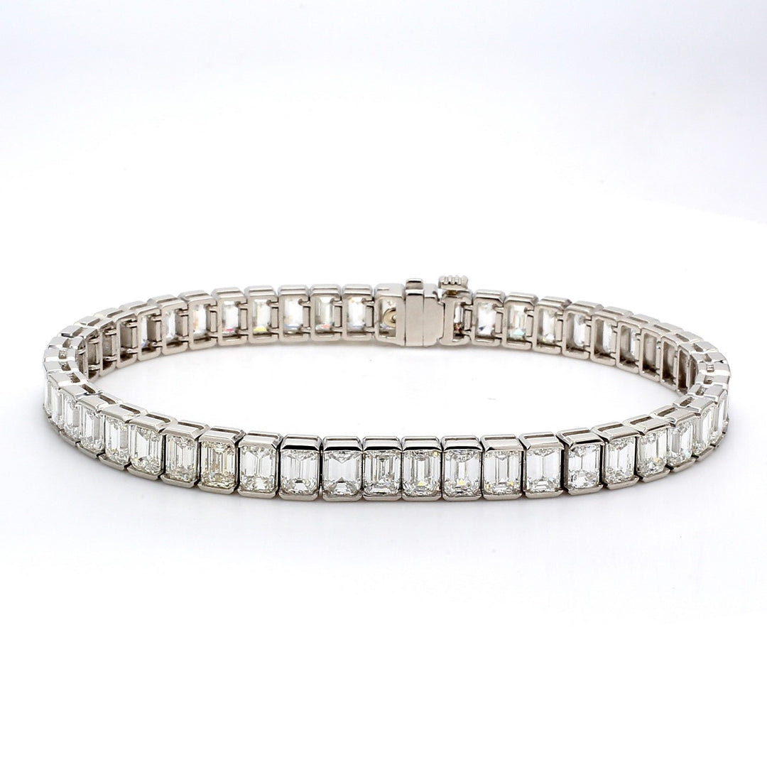 7"" Tennis bracelet in platinum with channel set (50) emerald cut diamonds.  D15.90ct.t.w.