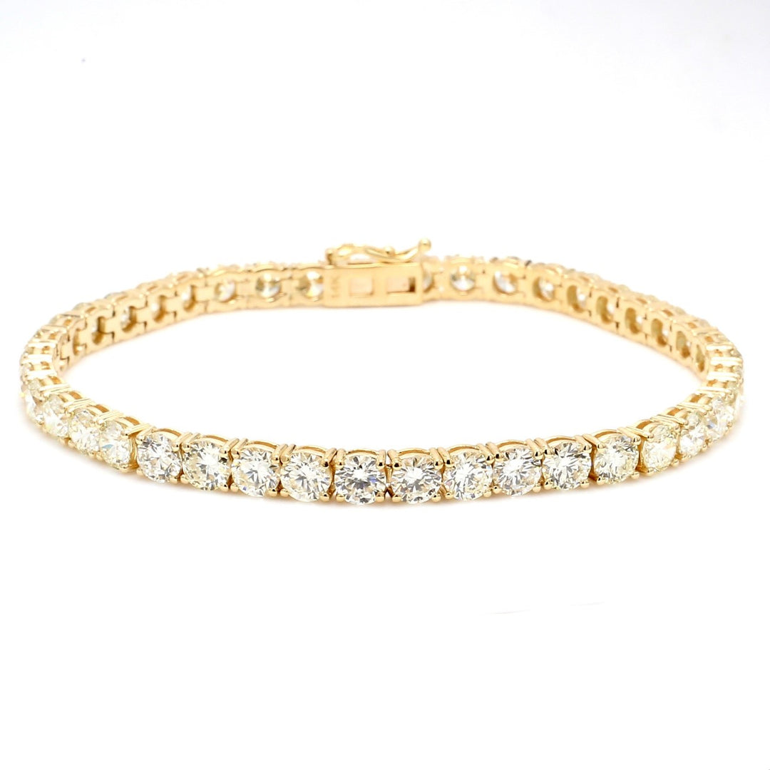 7.25"" Tennis bracelet in yellow gold with 4-prong set (47) round diamonds.  D8.98ct.t.w.