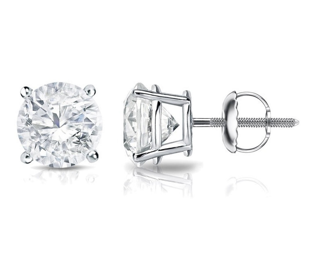 Screw back stud earrings with prong set round diamonds.  D3.01ct.t.w.