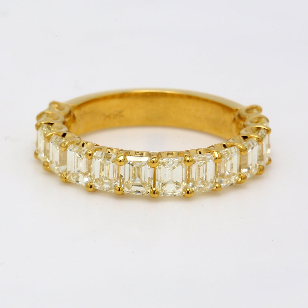 Single row band in 18K YG with shared U-prong set FY/VS (14) emerald cut diamonds.  D3.36ct.t.w.  Size 6