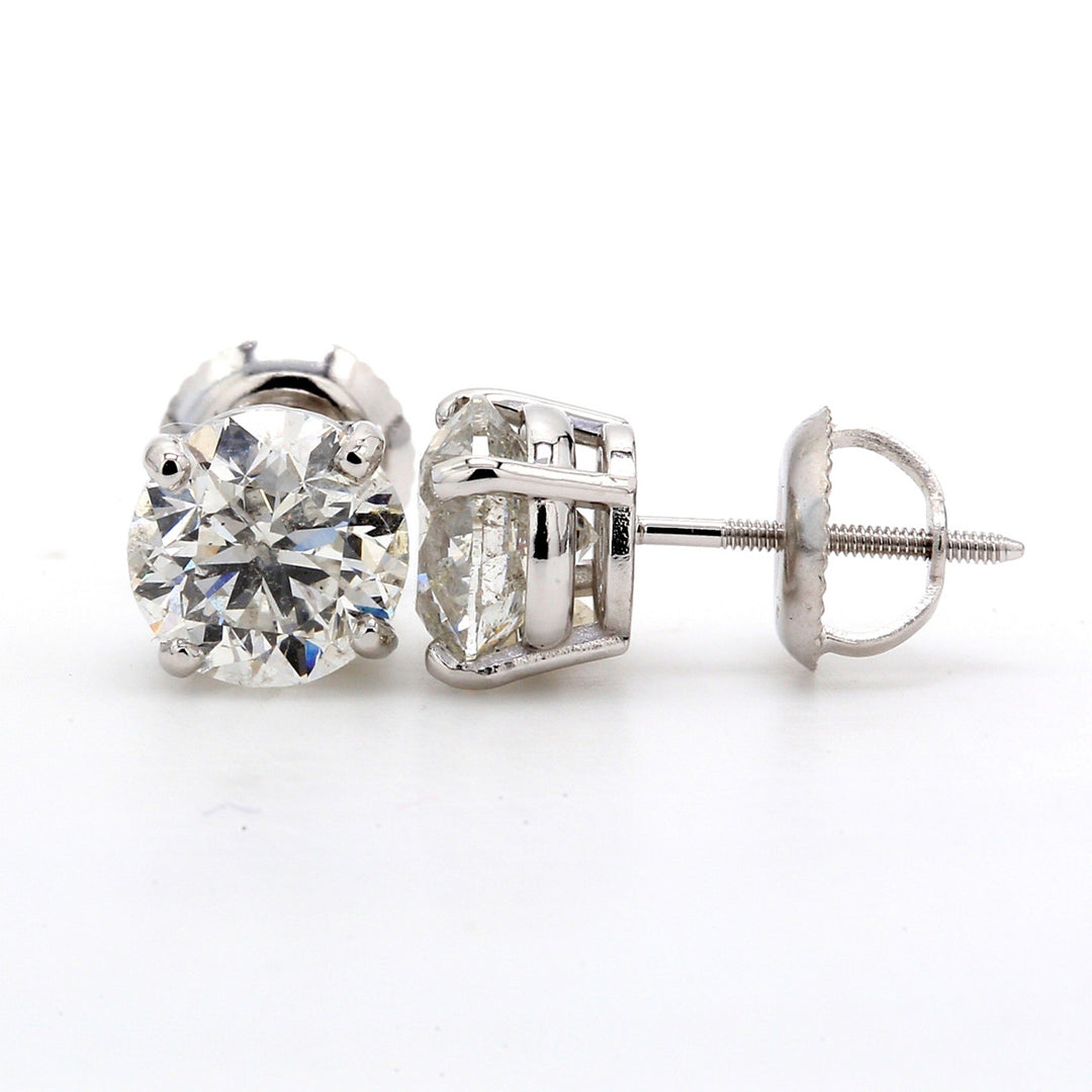 Screw back stud earrings with 4-prong set USA certified G-H/SI1 round diamonds.  D2.02ct.t.w.