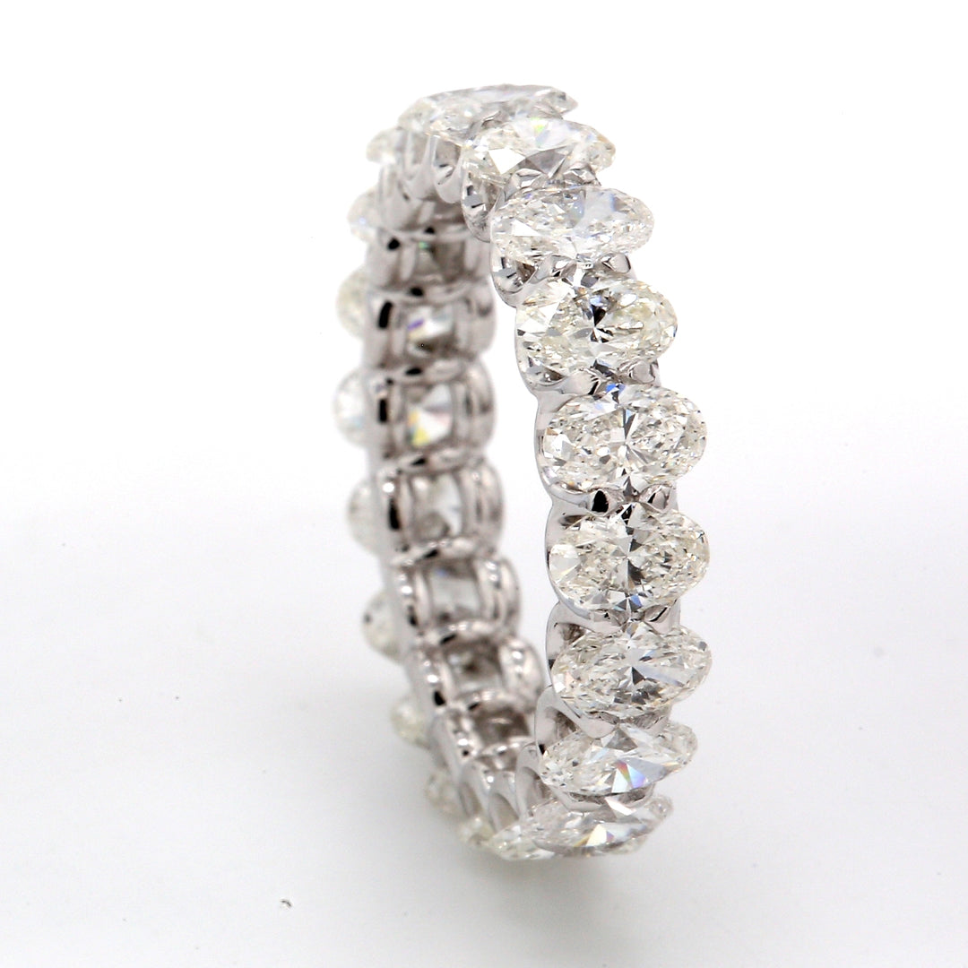 Eternity band in platinum with shared U-prong set (20) oval cut diamonds.  D3.07ct.t.w.  Size 4