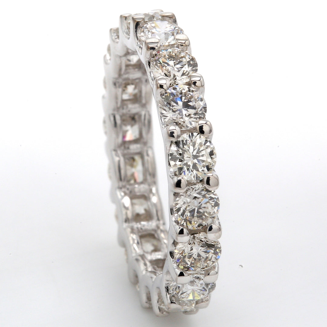 Eternity band with shared U-prong set (18) round diamonds.  D3.33ct.t.w.  Size 6.25
