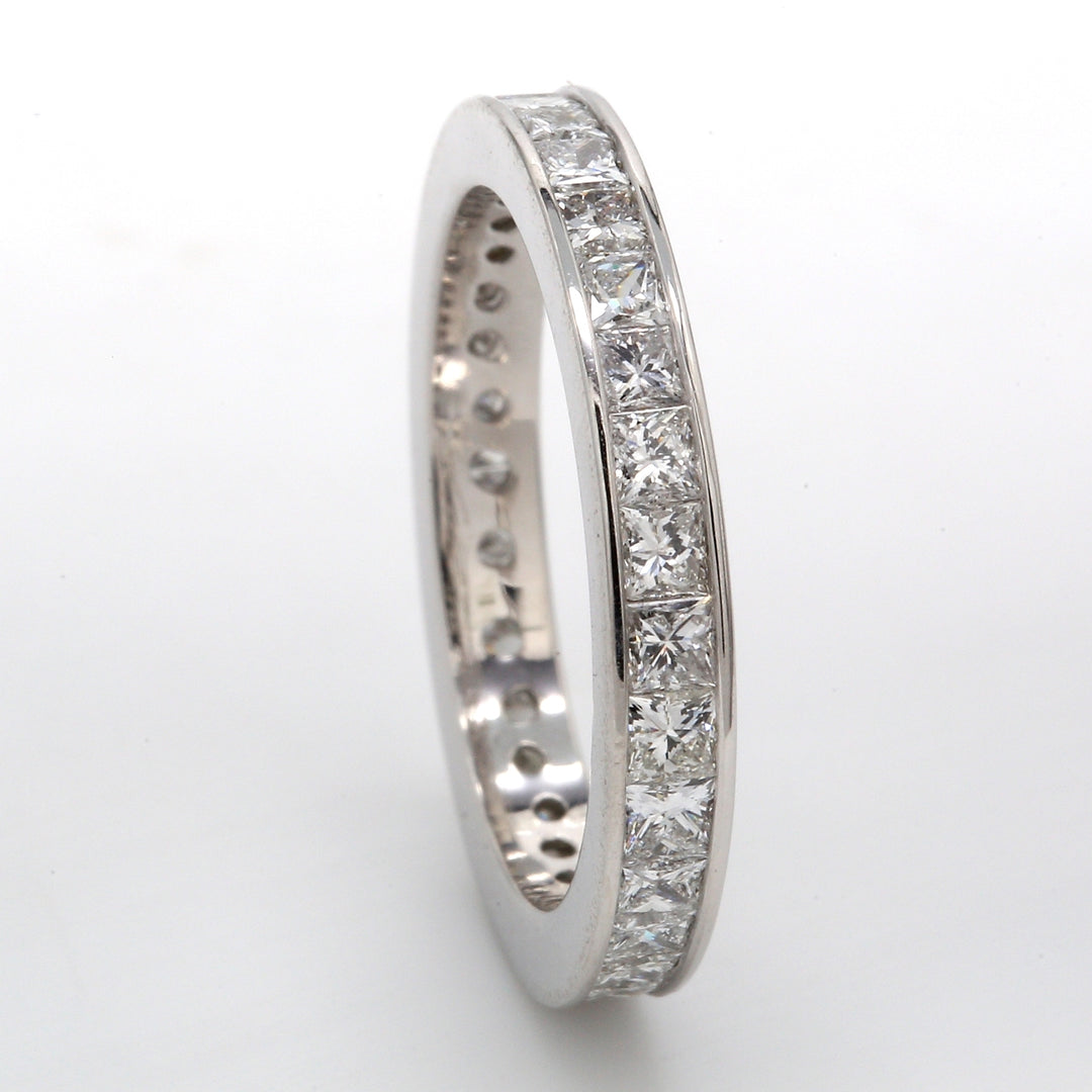 Eternity band with channel set (31) princess cut diamonds.  D2.02ct.t.w.  Size 6