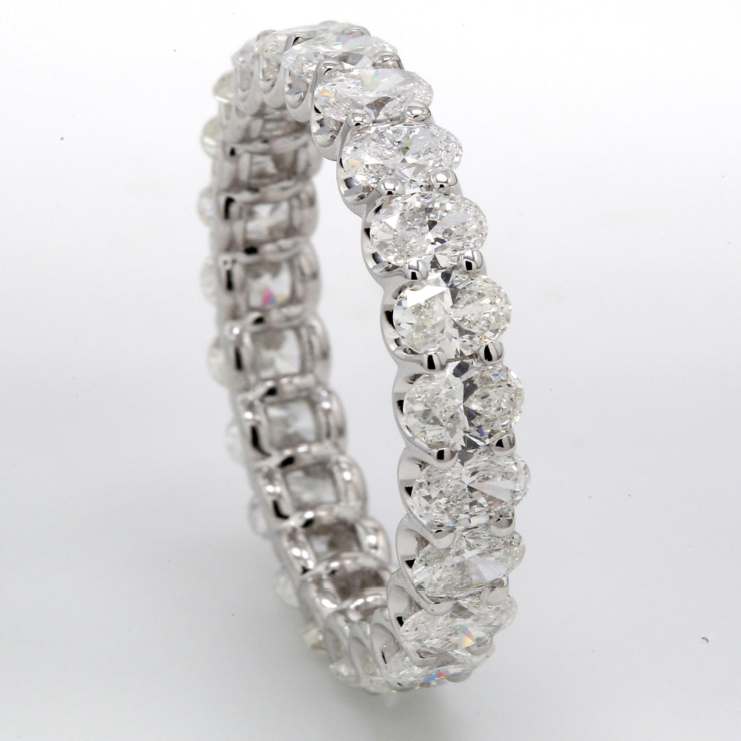 Eternity band with shared U-prong set (23) oval cut diamonds.  D5.06ct.t.w.  Size 9.25