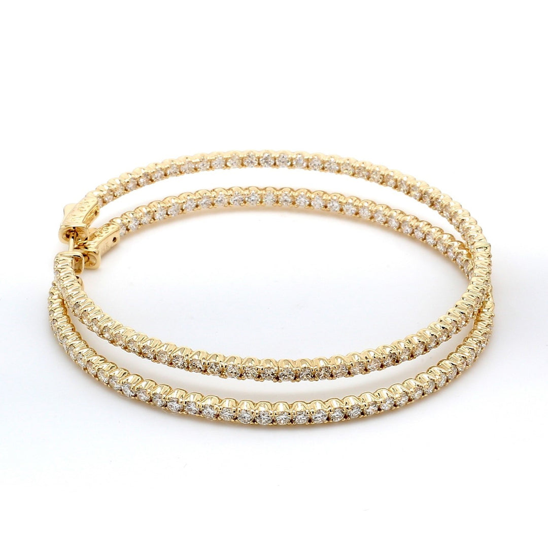 2.25"" Inside out hoop earrings in yellow gold with 4-prong set (138) round diamonds & with special spring lock.  D4.57ct.t.w.