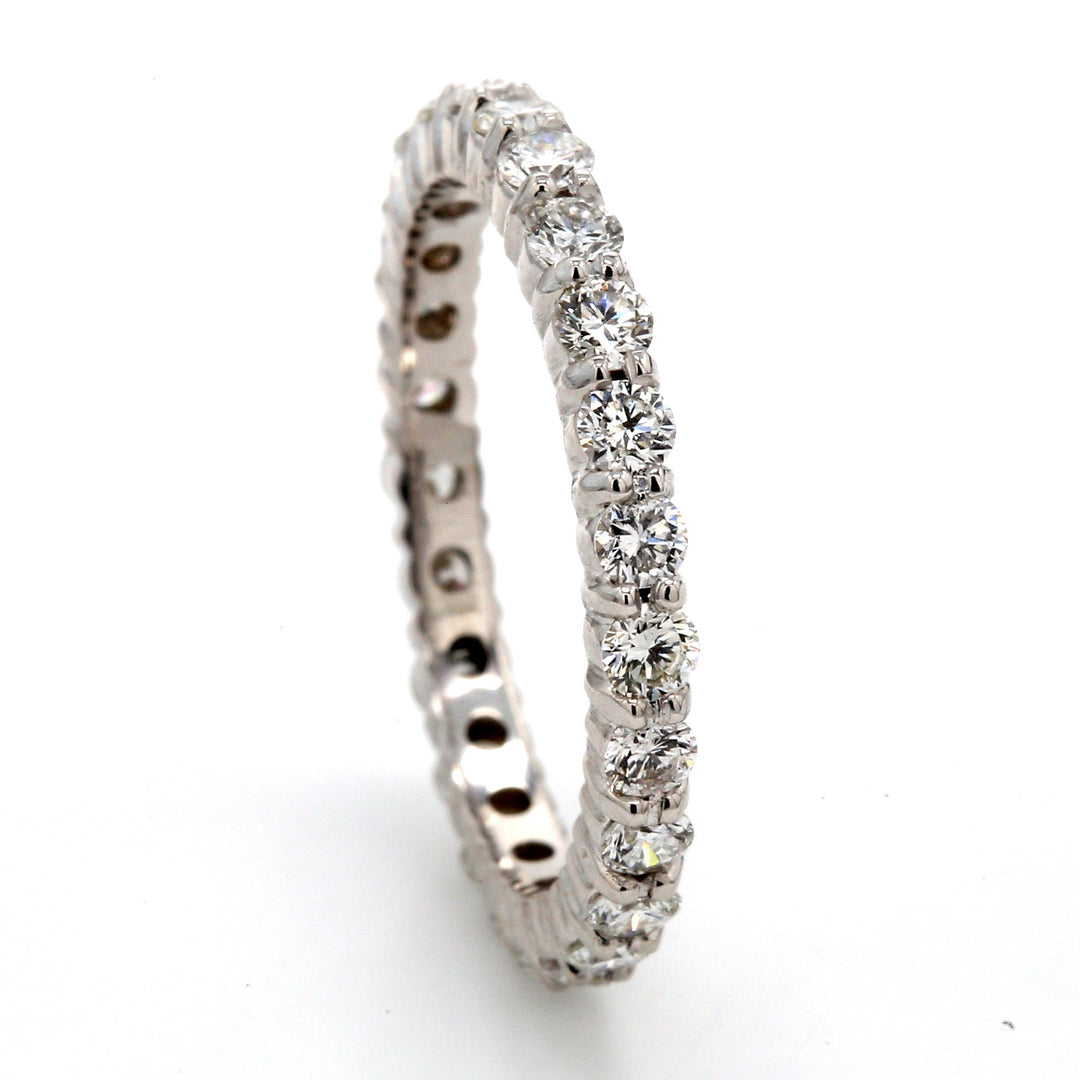 Eternity band with shared prong set (25) round diamonds.  D1.06ct.t.w.