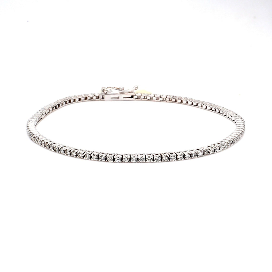 7"" Tennis bracelet in 1K WG 4-prong set (69) round diamonds.  D3.26ct.t.w.