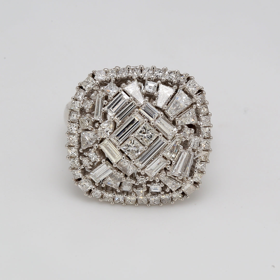 Halo cushion shaped ring in 18K WG with prong set assorted shape diamonds.  D3.32ct.t.w.  Size 6.75