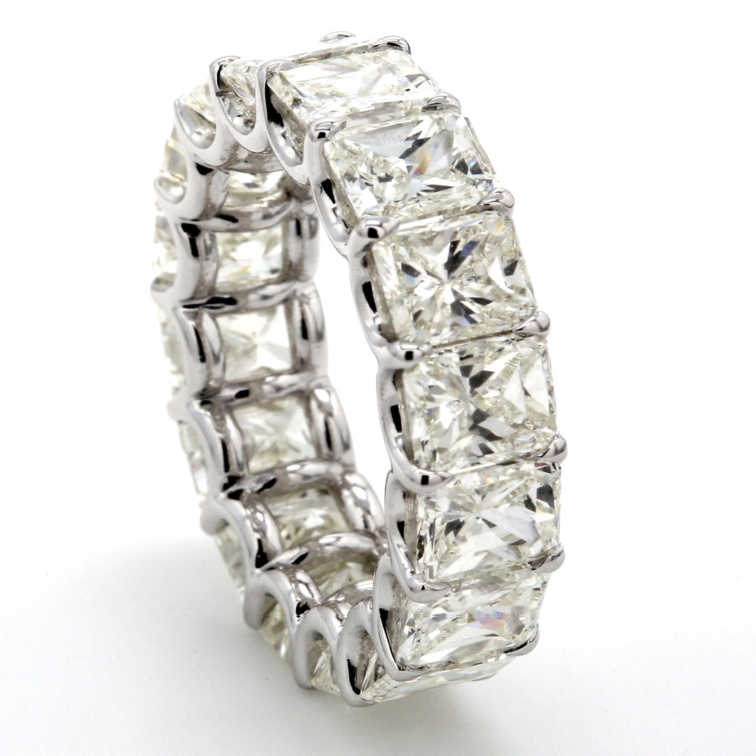 Eternity band in platinum with shared U-prong set (16) radiant cut diamonds.  D11.77ct.t.w.  Size 5.75