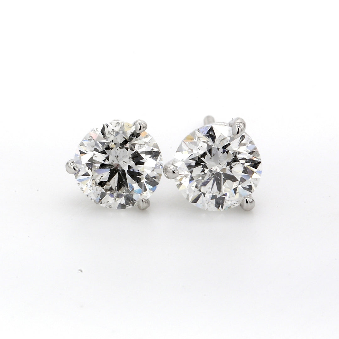 Screw back martini style stud earrings with 3-prong set F-G/I1 round diamonds.  D2.00ct.t.w.