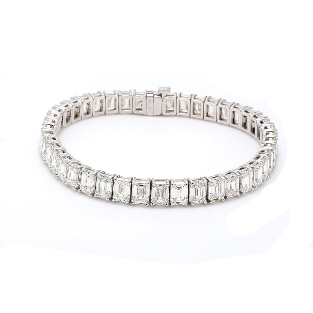 7"" Tennis bracelet in platinum with basket prong set GIA certified G-I/VVS1-VS2 (44) emerald cut diamond.  D22.55ct.t.w.