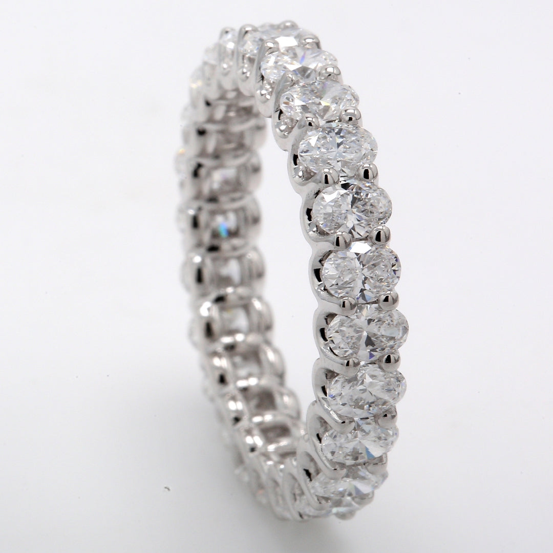 Eternity band with shared prong set (24) oval cut diamonds.  D3.20ct.t.w.  Size 7.25