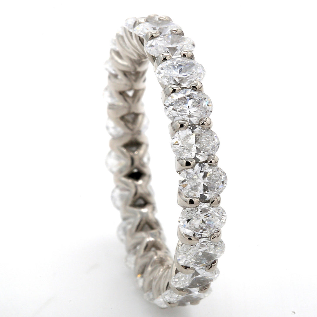 Eternity band in platinum with U-prong set (23) oval diamonds.  D3.33ct.t.w.  Size 6.5