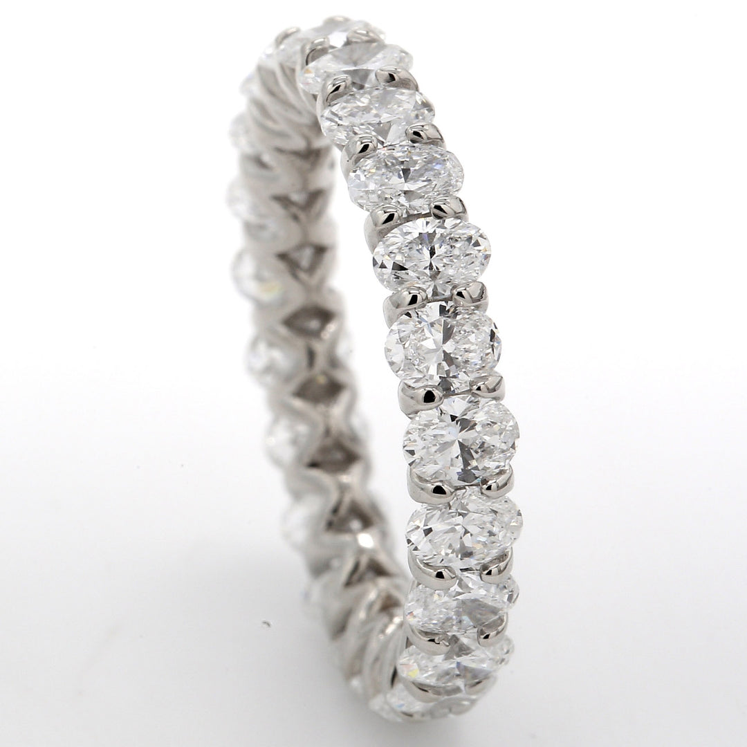 Eternity band in platinum with U-prong set (23) oval diamonds.  D3.17ct.t.w.  Size 6