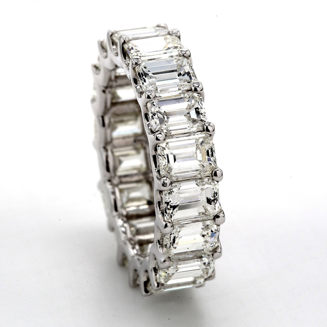 Eternity band in platinum with shared U-prong set (26) emerald cut diamonds.  D3.68ct.t.w.  Size 6