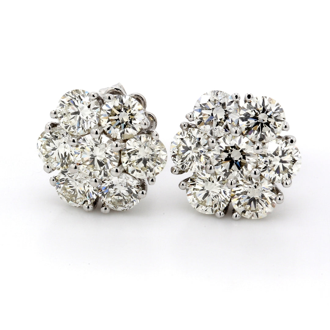 Screw back stud cluster earrings with prong set (14) round diamonds.  D3.53ct.t.w.