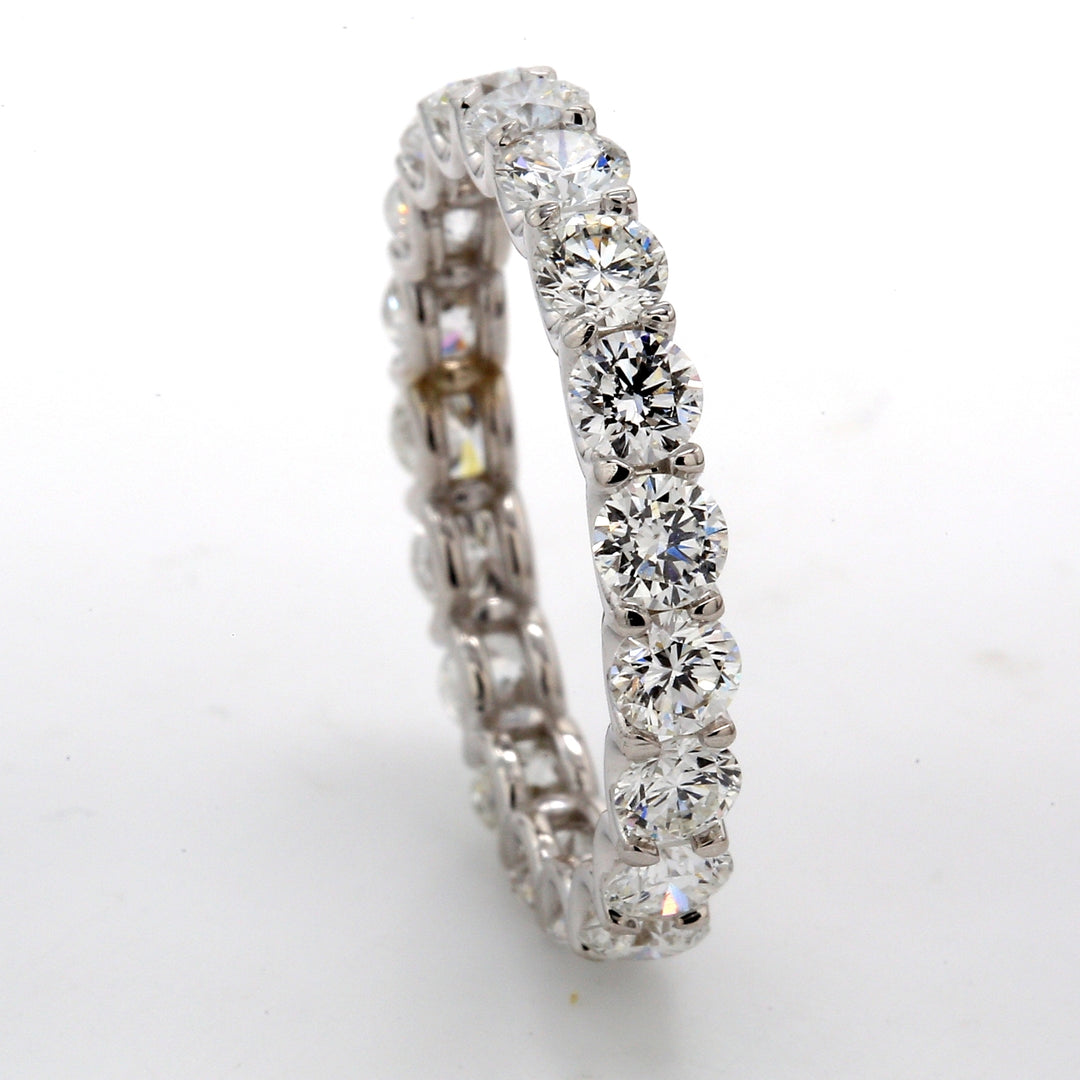 Eternity band in 18K WG with shared U-prong set (19) round diammonds.  D2.58ct.t.w.  Size 6