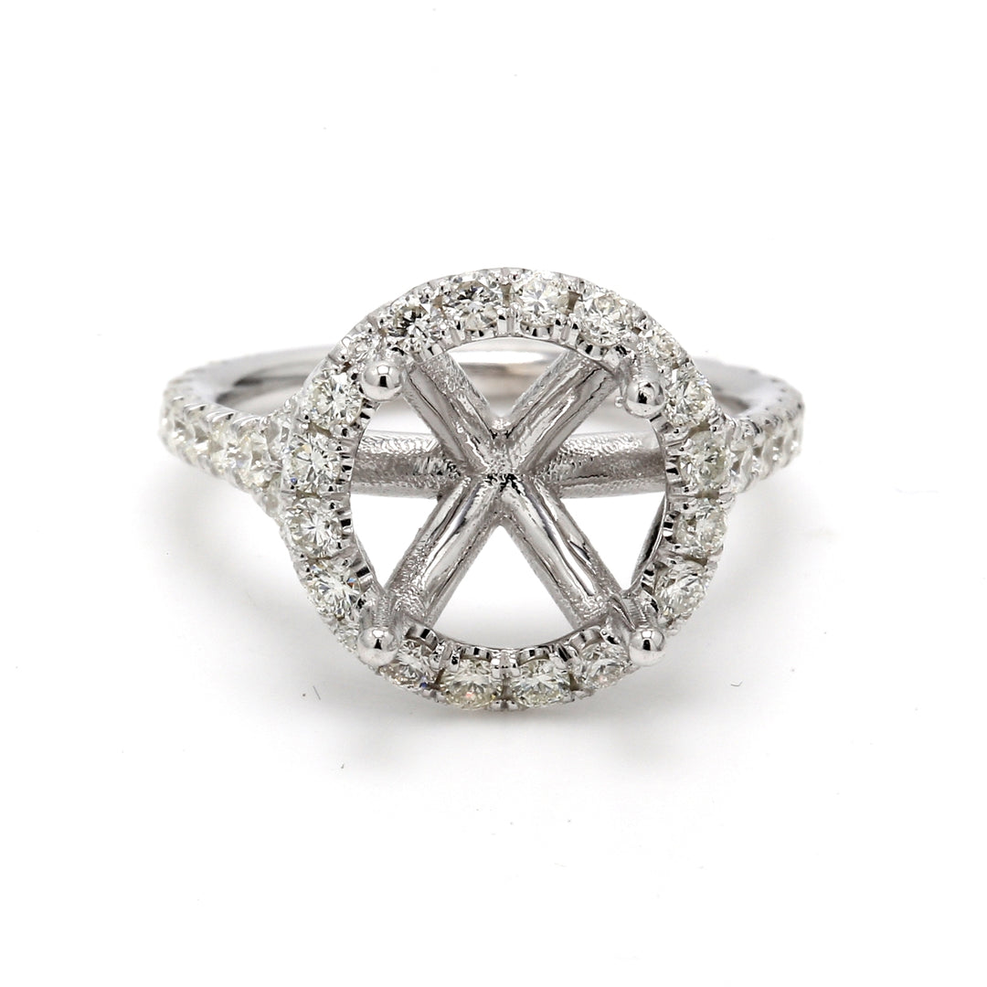 Halo semi-mount in white gold with prong set round diamonds.  D0.88ct.t.w.  Size 5