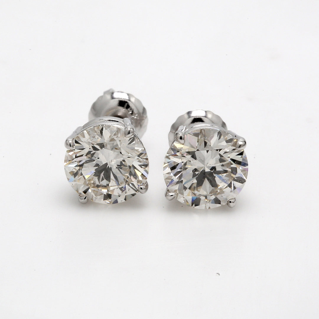 Screw back stud earrings with 4-prong basket set round diamonds.  D3.30ct.t.w.