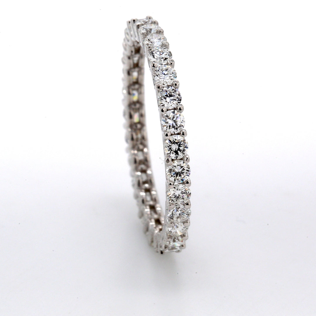 Eternity band with shared U-prong set (28) round diamonds.  D0.95ct.t.w.  Size 5
