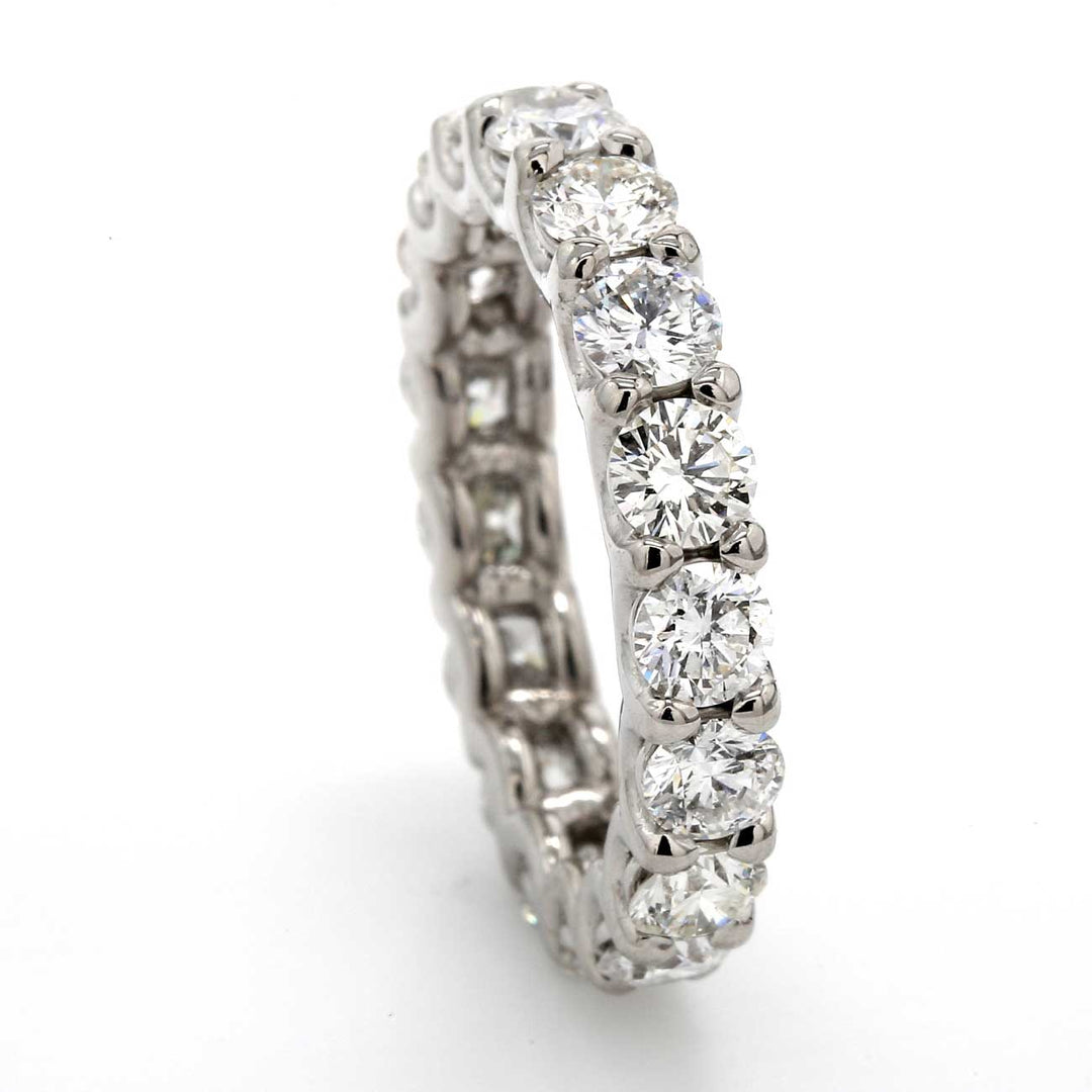 Eternity band in 18K WG with shared U-prong set (22) round diamonds.  D2.16ct.t.w.