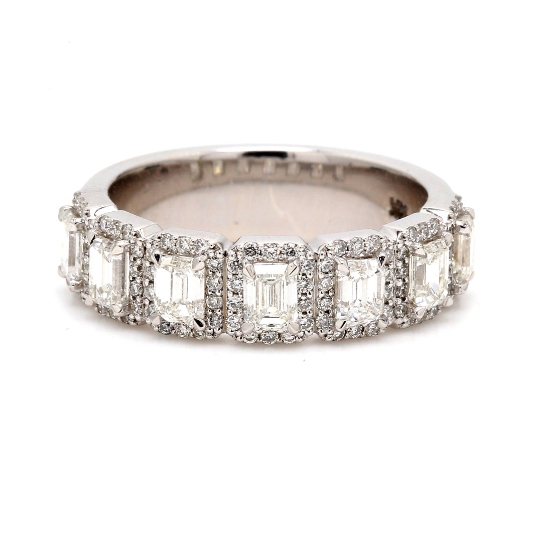 Halo band in white gold with (7) emerald centers and 4-prong set round diamonds.  D1.82ct.t.w.  Size 6
