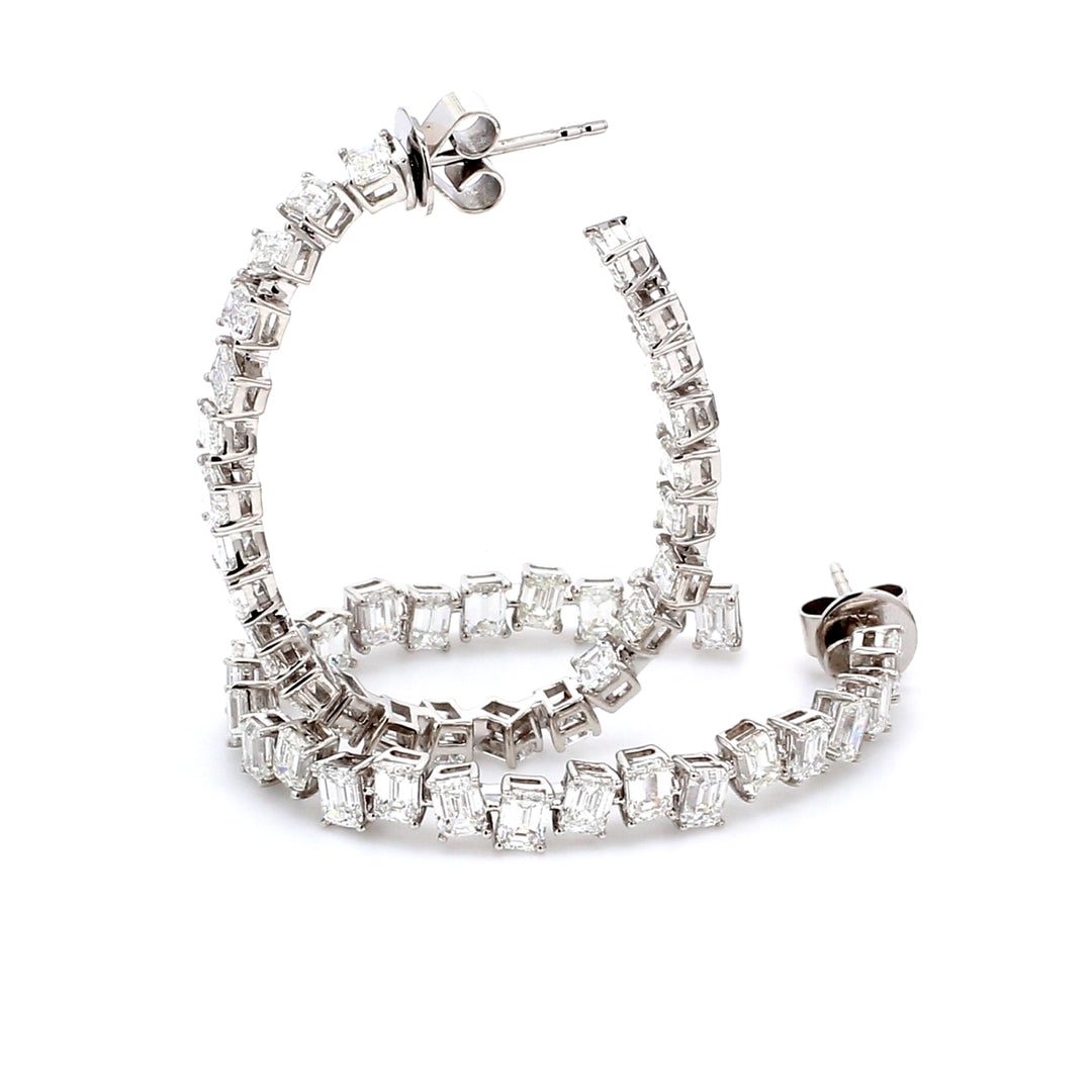 Push back oval shaped inside out hoop earrings in 18K WG with 4-prong set (50) emerald cut diamonds.  D7.20ct.t.w.