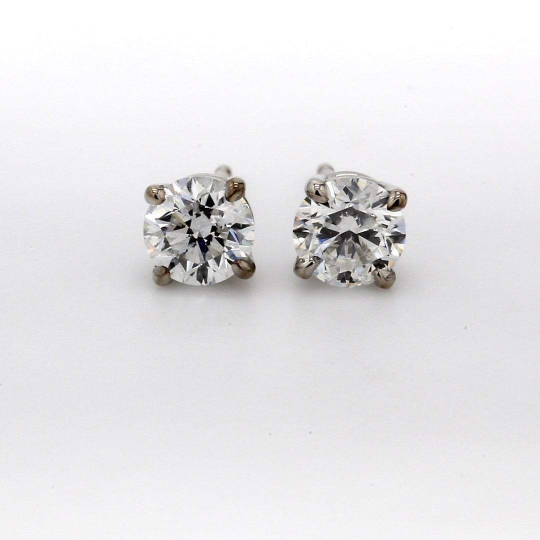 Push back stud earrings with basket 4-prong set round diamonds.  D0.80ct.t.w.