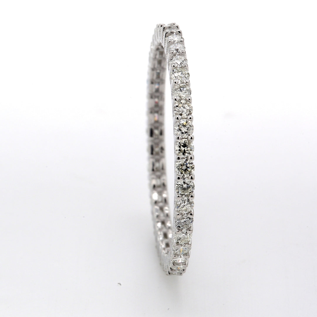 Eternity band with shared 4-prong set (40) round cut diamonds.  D0.62ct.t.w.  Size 7