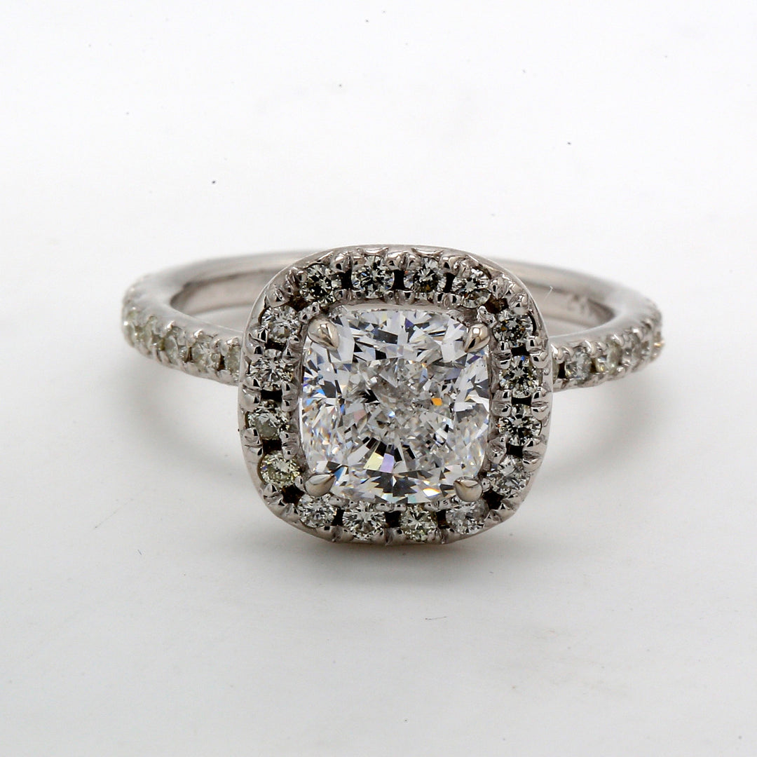 Halo ring with prong set rounds around GIA certified D/SI1 cushion diamond centerstone.  D2.53ct.t.w.  (Center 2.01ct.)  Size 5.5