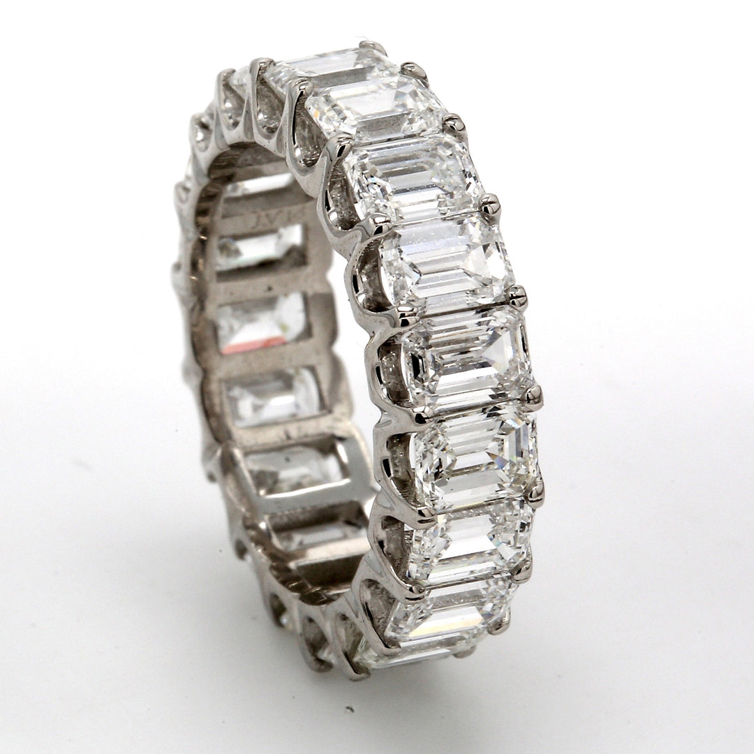 Eternity band in platinum with U-prong set (19) emerald cut diamonds.  D5.87ct.t.w.  Size 5.5