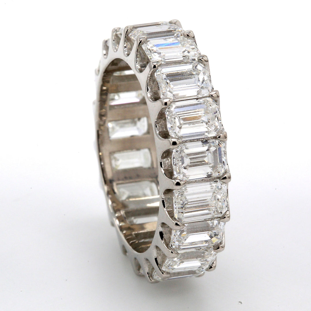 Eternity band in platinum with U-prong set (19) emerald cut diamonds.  D5.84ct.t.w.  Size 5.5
