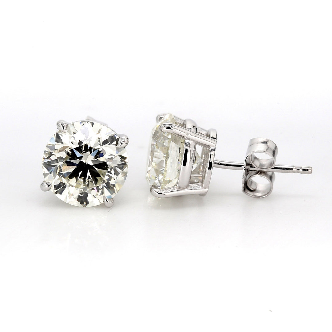 Push back stud earrings with 4-prong set USA certified I/SI2 round diamonds.  D4.01ct.t.w.