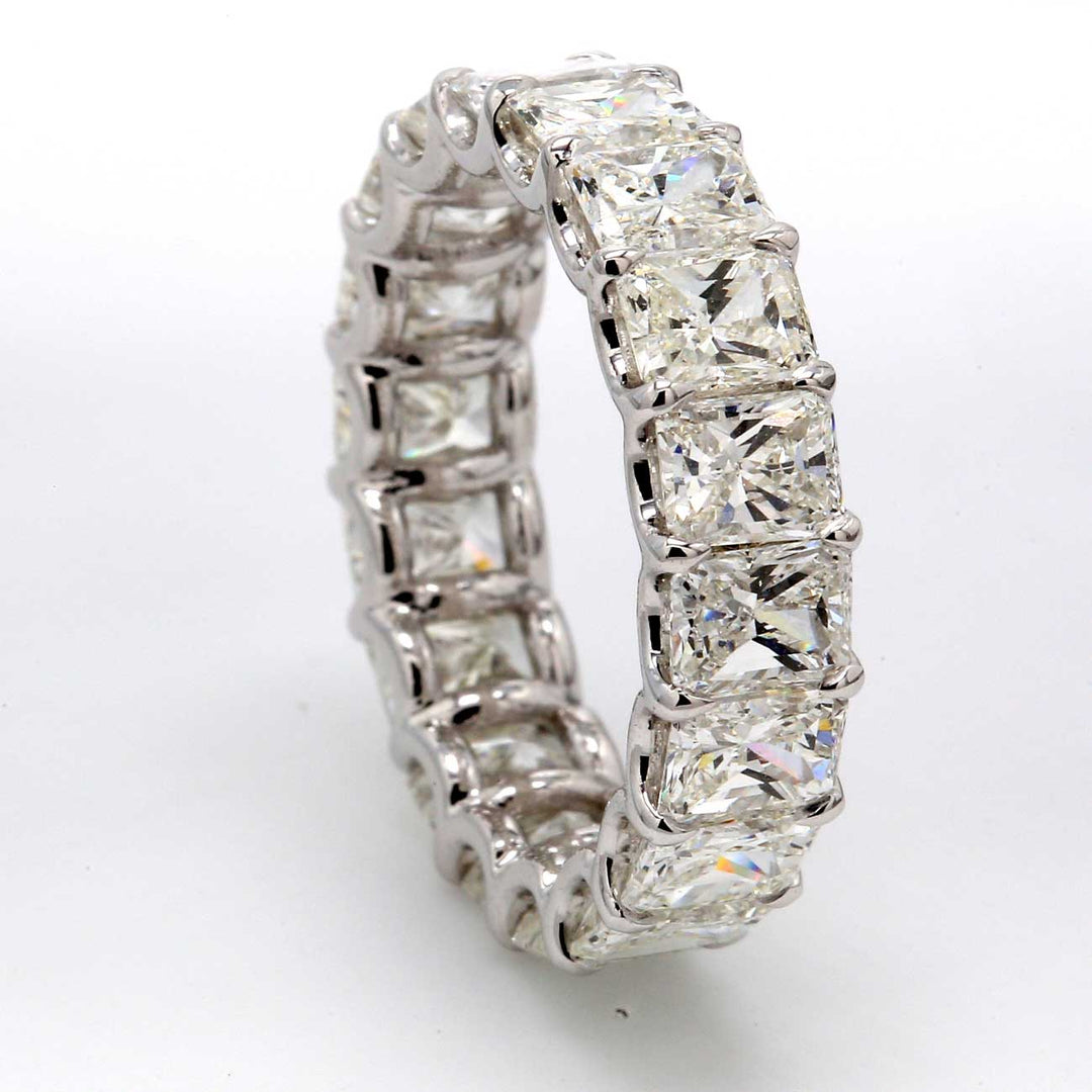 Eternity band in platinum with U-prong set (18) radiant cut diamonds.  D5.68ct.t.w.  Size 5