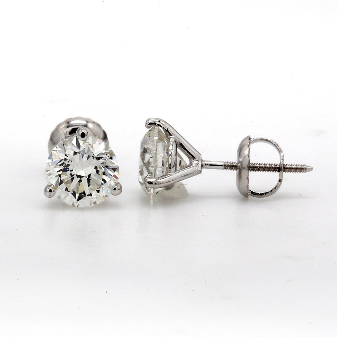 Screw back stud earrings with eagle claw 3-prong set USA certified H-I/SI1-SI2 round diamonds.  D3.00ct.t.w.