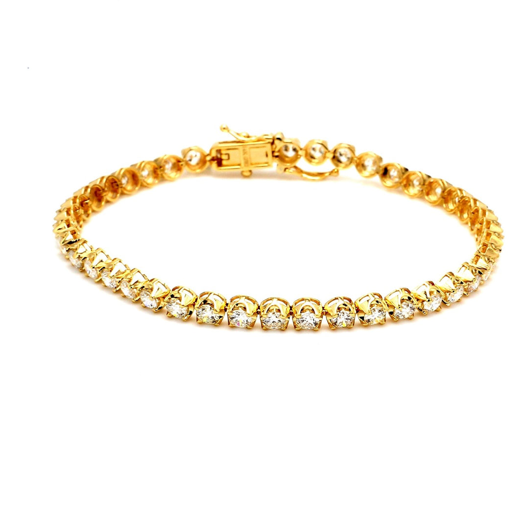 7.5"" Tennis bracelet in 14K YG with illusion prong set (42) round diamonds.  D5.36ct.t.w.