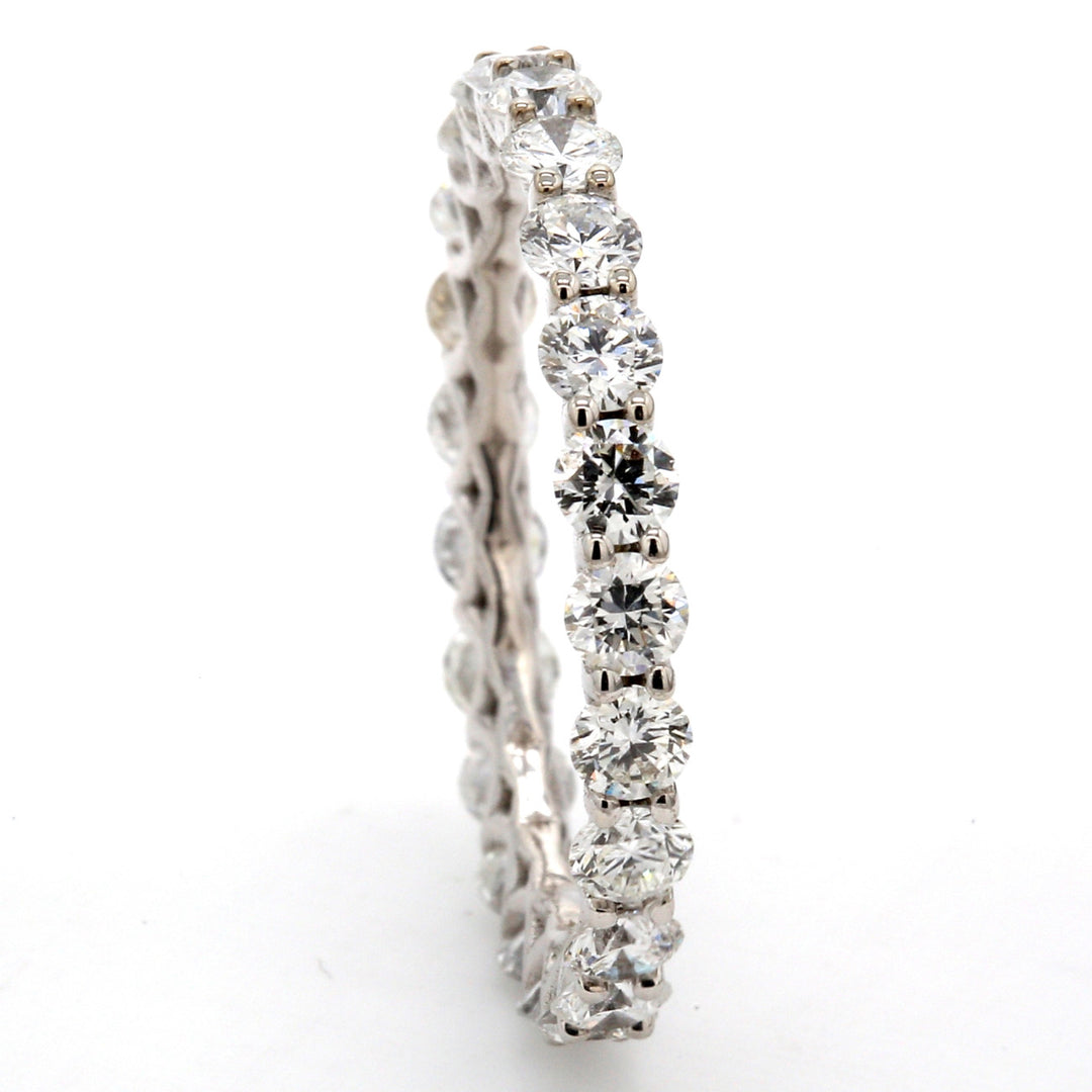 Eternity band in 18K WG with U-prong set (23) round diamonds.  D1.74ct.t.w.  Size 6.5