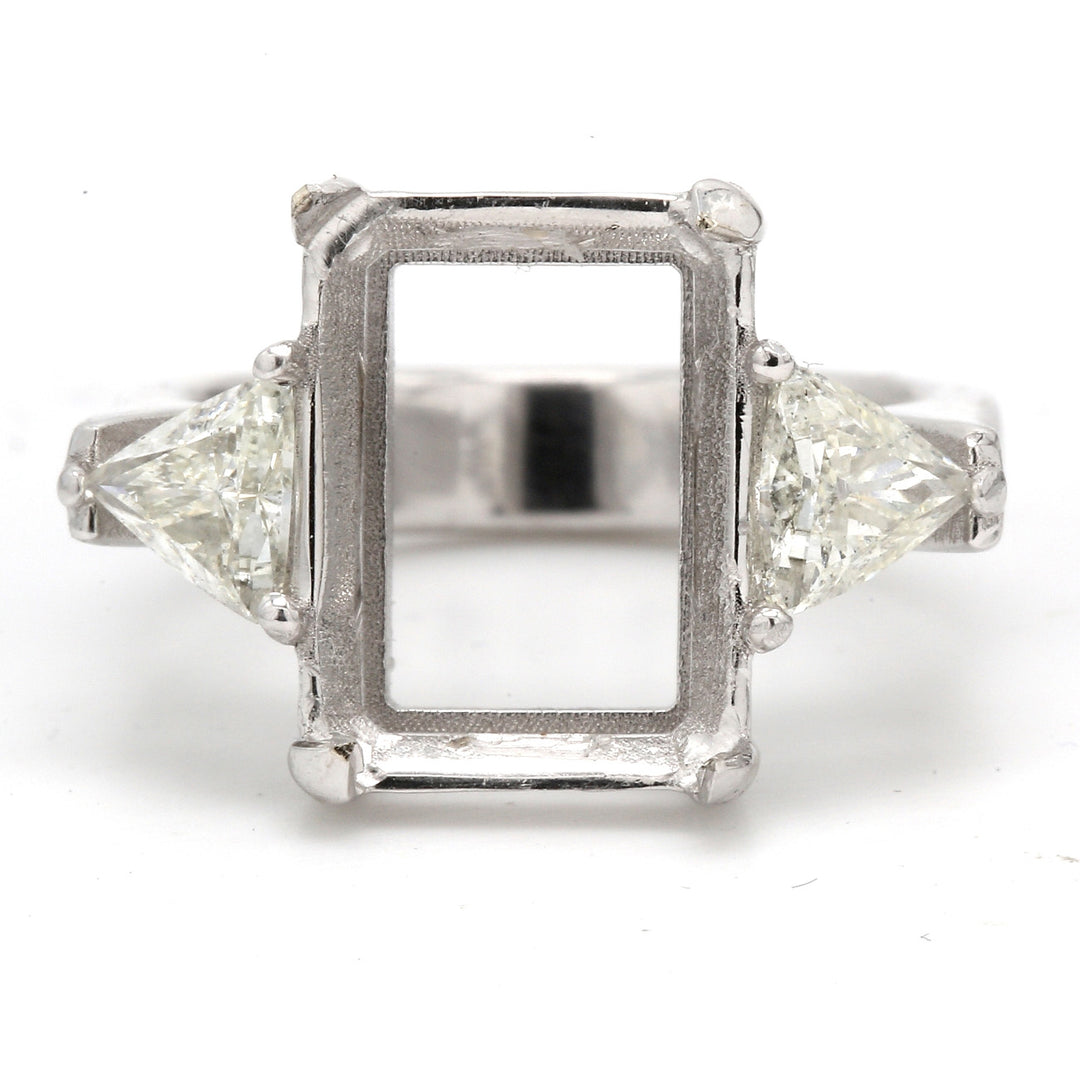 3-stone semi-mount with eagle claw prong setting for center and trilliant diamond sides.  D1.02ct.t.w.  Size 9