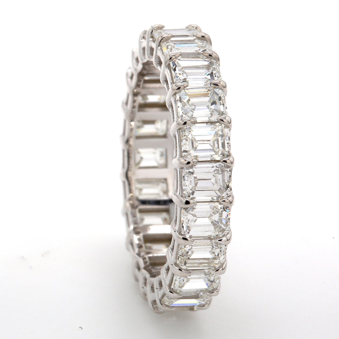 Eternity band in 18K WG with shared basket prong set (22) emerald cut diamonds.  D4.42ct.t.w.  Size 6