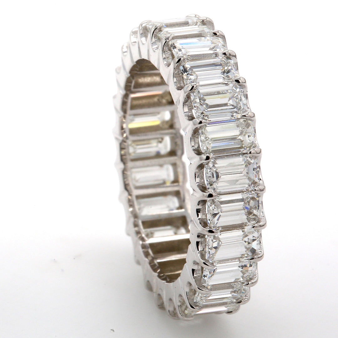 Eternity band in 18K WG with U-prong set (25) emerald cut diamonds.  D4.94ct.t.w.  Size 7