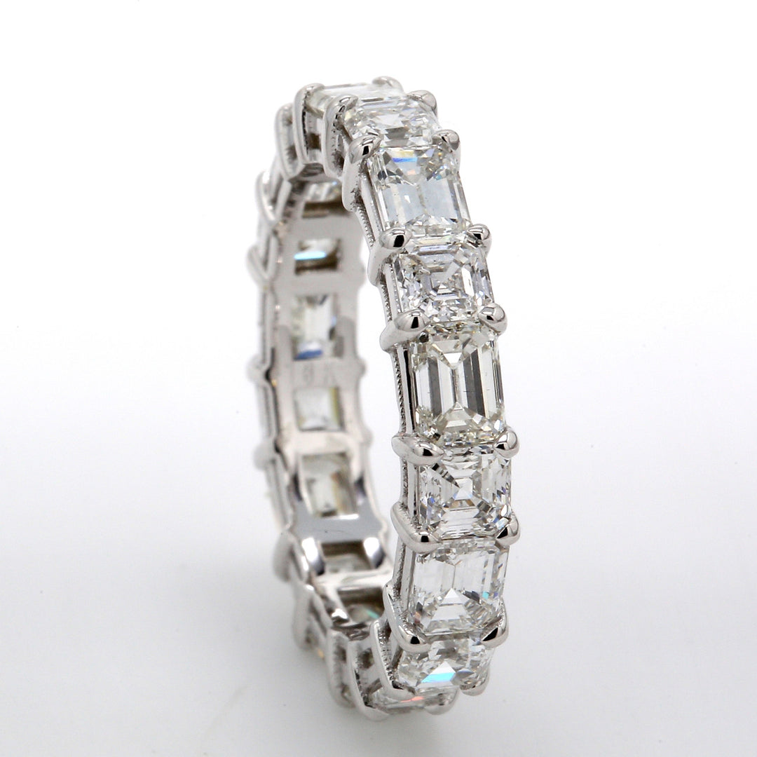 Eternity band in 18K WG with alternating basket prong set (9) emerald cut and (9) asscher cut diamonds.  D3.92ct.t.w.  Size 5.5