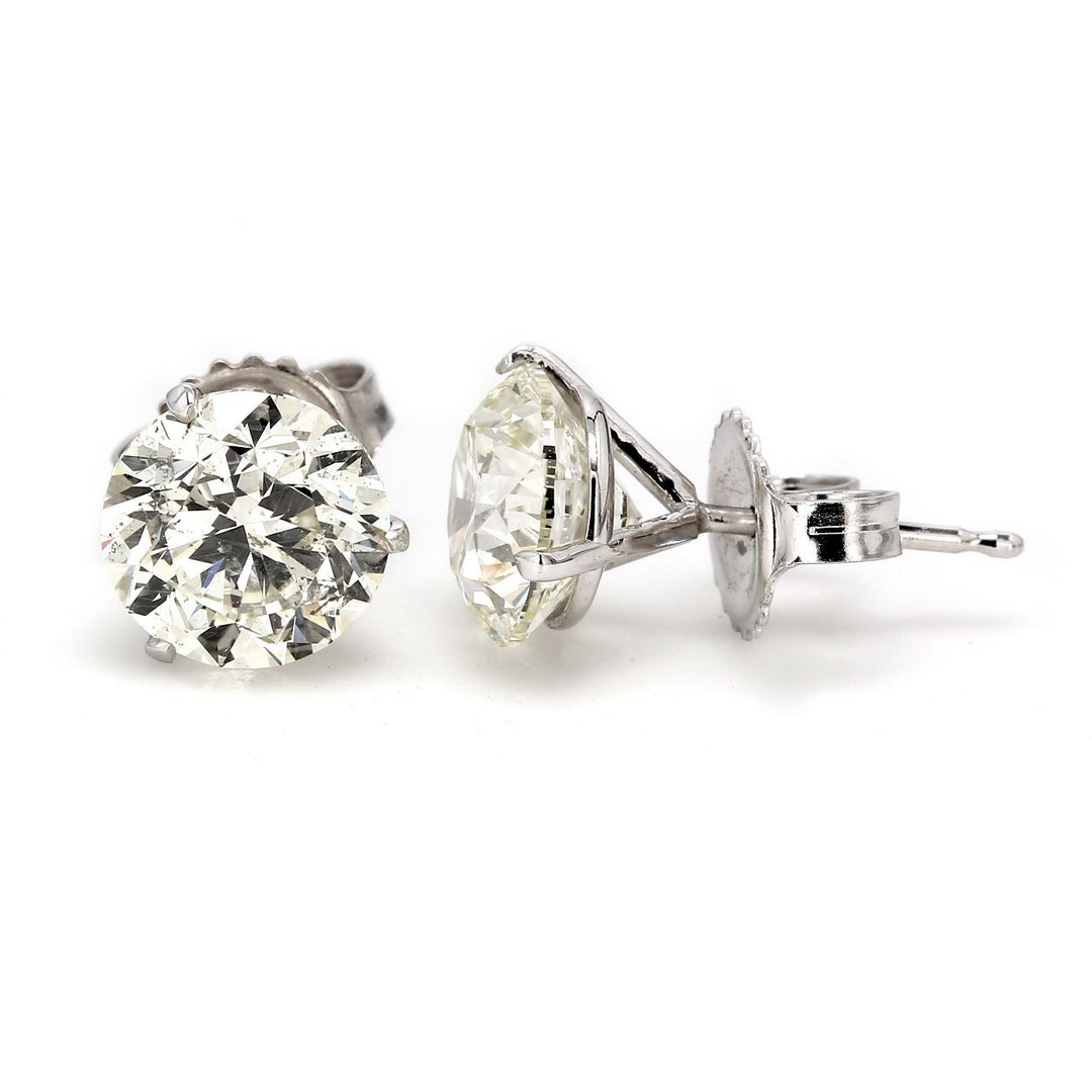 Push back martini style stud eaarings with prong set USA certified I-J/SI2 round diamonds.  D4.01ct.t.w.