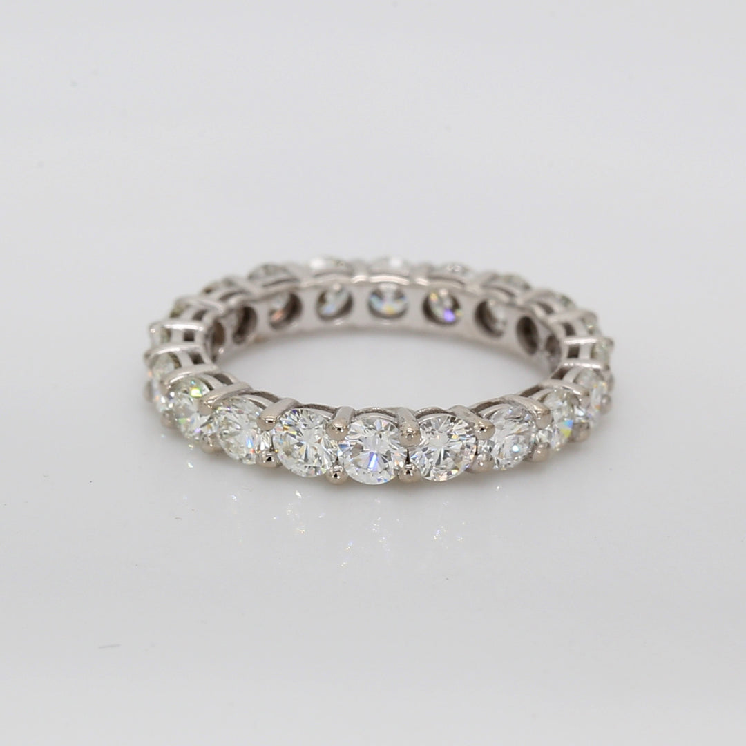 Eternity band with shared basket prong set round diamonds.  D2.07ct.t.w.  Size 4.5